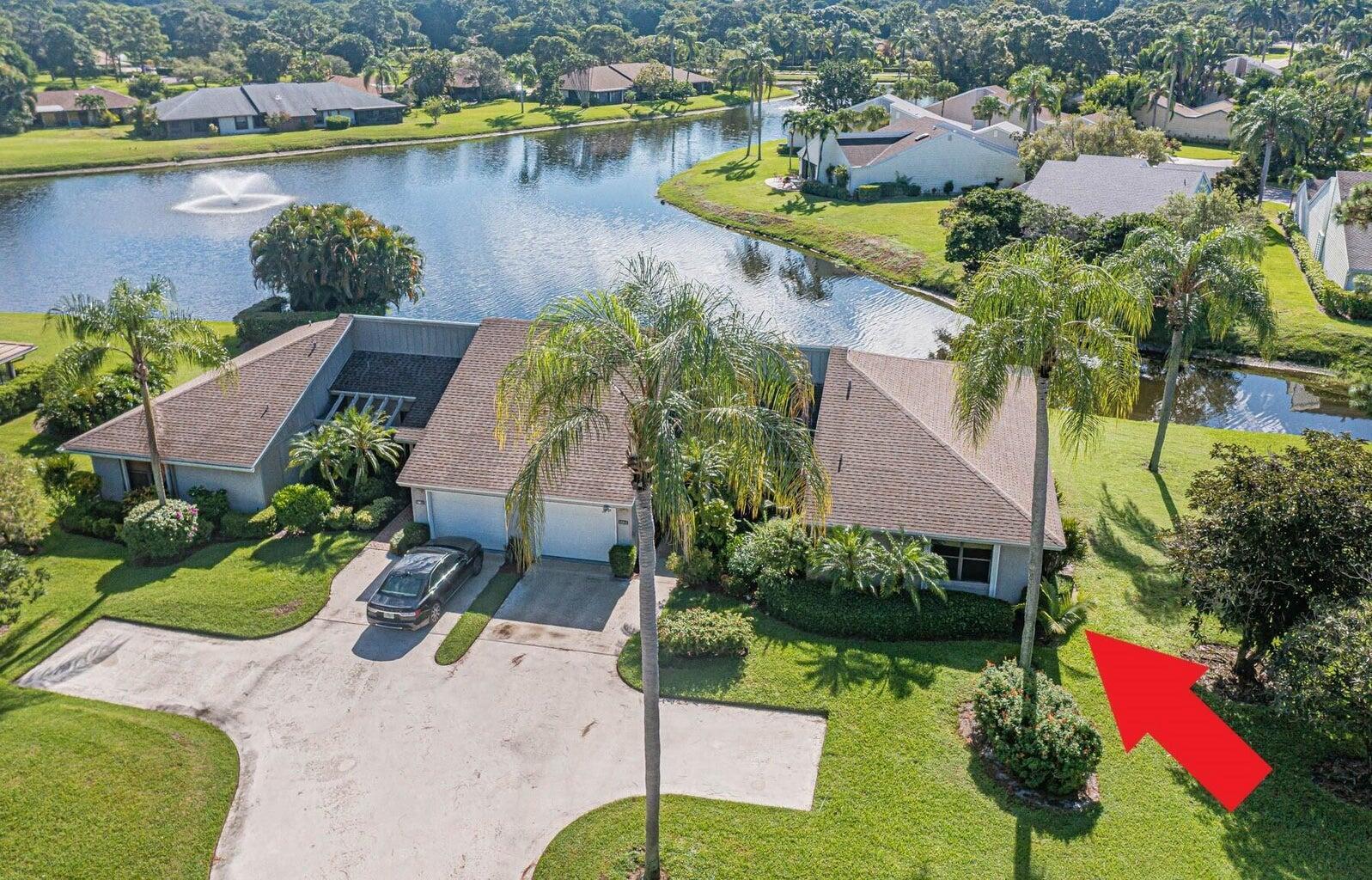 Gorgeous lake view from this beautiful 3 bed, 2 bath, 1 car garage Villa! Boost your mood, bask in the natural sunlight and admire the sunsets from the spacious sunroom! Very Private! House sits back from the road. Prestigious 24/7 manned gated community with 2 golf courses, 2 heated pools, HOV-TRU tennis courts, driving range, winding sidewalks, putting green, pro-shop, beautiful restaurant, bar & more. Superb location, near I-95, shopping, restaurants, beach and a short drive to the airport.