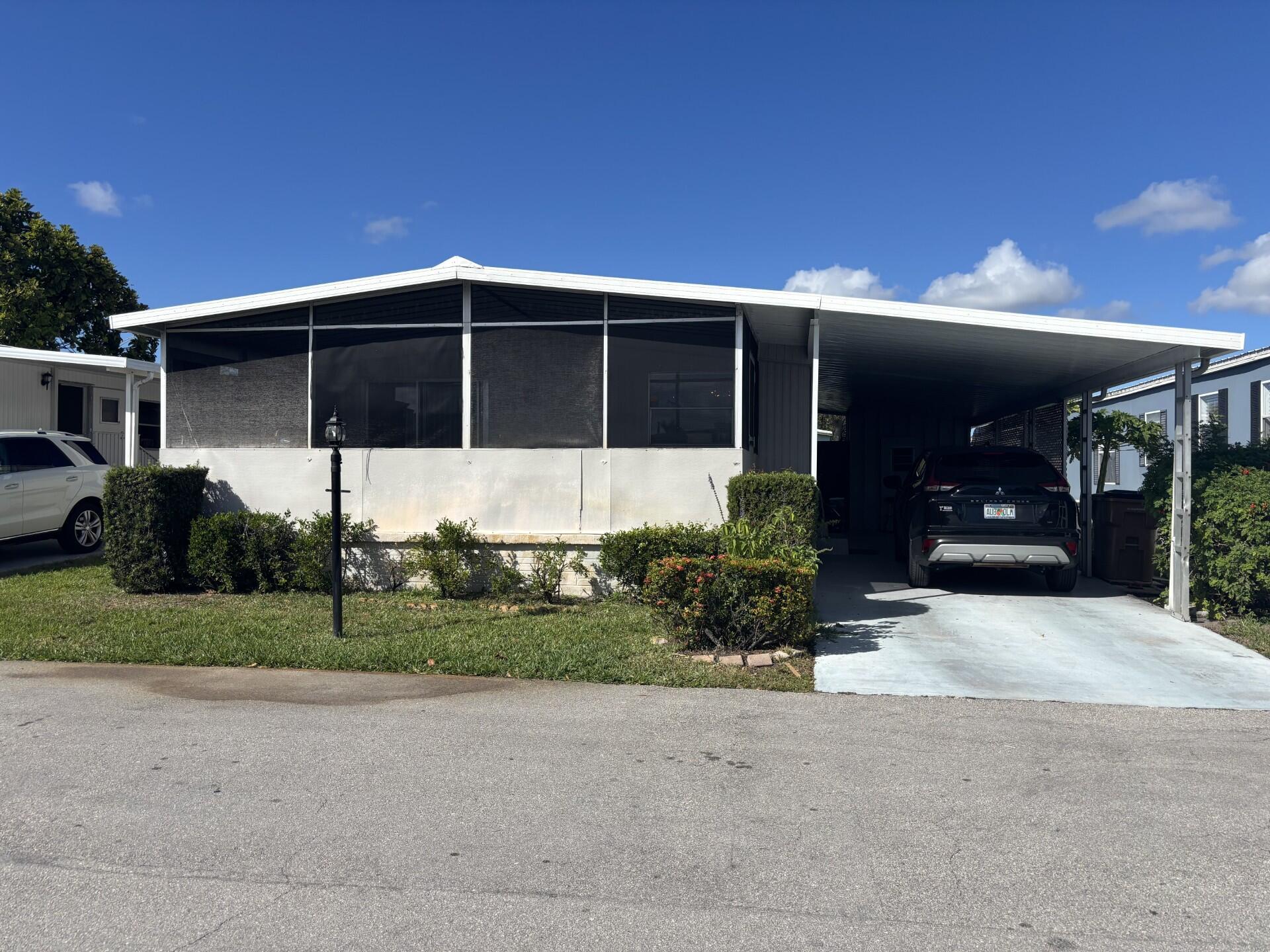 PRICE REDUCED!!!DON'T MISS THE OPPORTUNITY TO VIEW THIS SPACIOUS 2 BEDROOM 2 BATH HOME, AT TIDEWATER ESTATES, A QUIET 55+ COMMUNITY, ONLY 3 MILES FROM DESIRABLE DEERFIELD BEACH!!! RECENT UPDATE INCLUDE NEW CENTRAL AIR, REFRIGERATOR, STOVE, NEW SINK ON MASTER BEDROOM, NEW WASHER AND NEW ELECTRIC PANEL. THIS LOCATION HAS ALL THE TRAVEL AMENITIES CLOSE AT HAND, AIRPORT, AMTRAK AND MAJOR HWYS. SNOWBIRDS FLOCK ON DOWN TO ESCAPE THE COLD WEATHER!LOT RENTAL $1,407 INCLUDING TAXES, LOAN MAINTENANCE AND ALL AMENITIES.