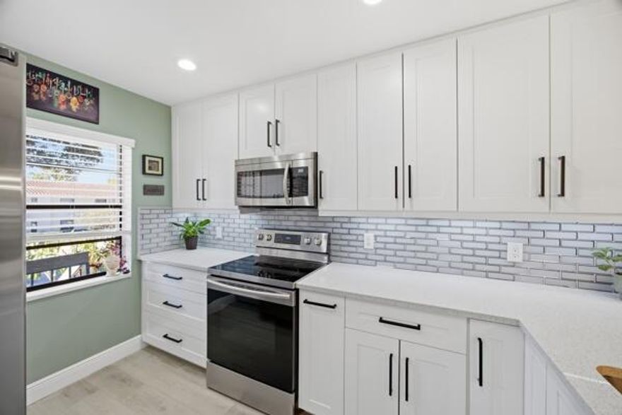 This beautifully updated 2-bedroom, 2-bath residence offers peaceful lake view and a thoughtfully redesigned interior that blends comfort with modern elegance. The renovated kitchen showcases contemporary quartz countertops, stainless steel appliances, and clean, timeless finishes ideal for both everyday living and entertaining.

Unwind in your private enclosed patio overlooking the tranquil lake the perfect space for morning coffee or relaxing evenings surrounded by nature. Ideally positioned within the community, residents enjoy convenient access to the nearby pool and clubhouse amenities.

Additional features include an in-unit washer and dryer, a community roof replacement completed in 2021, and maintenance fees that include cable and internet for added convenience. Golf membership is available but optional, allowing you to enjoy the Boca Lago lifestyle your way.
Located just minutes from premier shopping, dining, Town Center Mall, and major highways, this home offers the perfect balance of serenity and accessibility in one of Boca Raton's most established communities.