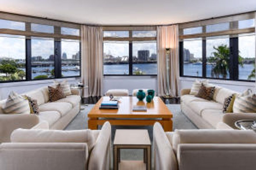 Unparalleled views & flooded w/ light, the privately accessed entry foyer leads directly into a stunning oversized living/entertaining space featuring impressive walls of glass. A sumptuous master suite with dual bathrooms & generous closet space. Guest bedroom with bath ensuite & den/3rd bedroom, all w/ expansive views. Built ins, recessed lighting, impact windows/doors, 2 garage parking spaces.