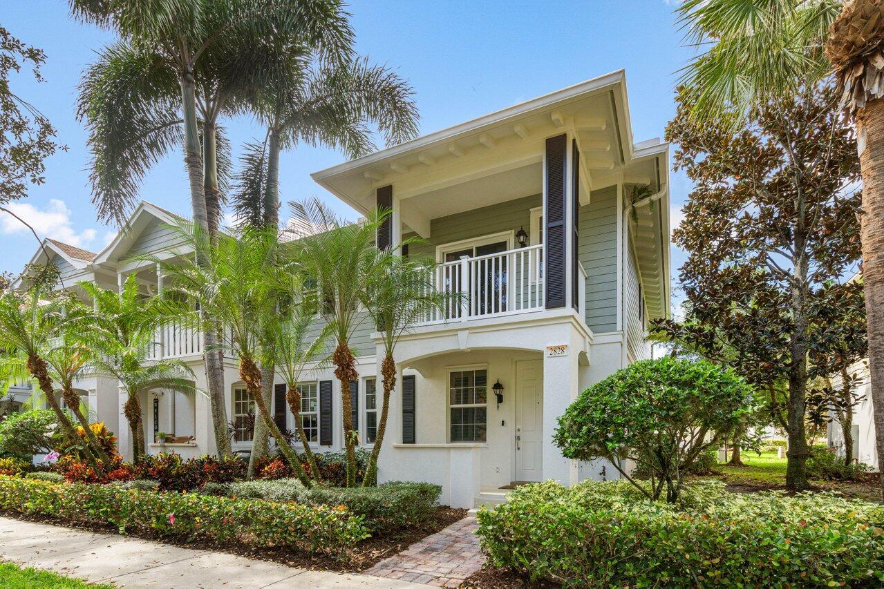 This beautifully updated 3-bedroom, 2.5-bath end unit townhouse with a one car garage is located in the desirable, centrally located Martinique neighborhood of Abacoa. Set on a charming tree-lined street with peaceful green space views from the front porch and balcony... this home offers both comfort and convenience. The community clubhouse and pool are just steps away. The interior features neutral tile flooring on the first floor and wood laminate on the stairs and second level. All cabinets were just updated/ painted by the very popular Not Too Shabby Co. The spacious primary suite includes a walk-in closet, an additional closet, and an ensuite bathroom with a double vanity, soaking tub, and separate shower. The two additional bedrooms offer excellent closet space, and