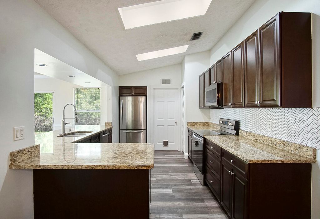 Photo of 1761 SW Anderson Street, Port Saint Lucie, FL 34953 (MLS # R10997592)