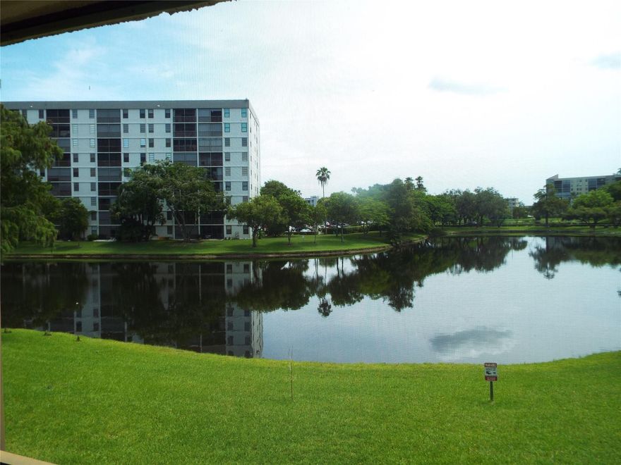 Wow! Come check out the incredible, peaceful lake view from this second floor unit!  The windows and balcony face east so you get the benefit of pleasant ocean breezes and no hot afternoon sun streaming into the unit.  The living room, master bedroom and balcony all have lake views.  Newer tile on balcony, new a/c in 2022, new water heater in 2022.  New base cabinets in the kitchen.  Convenient pass-thru from kitchen to dining area.  This apartment was just freshly painted through-out.