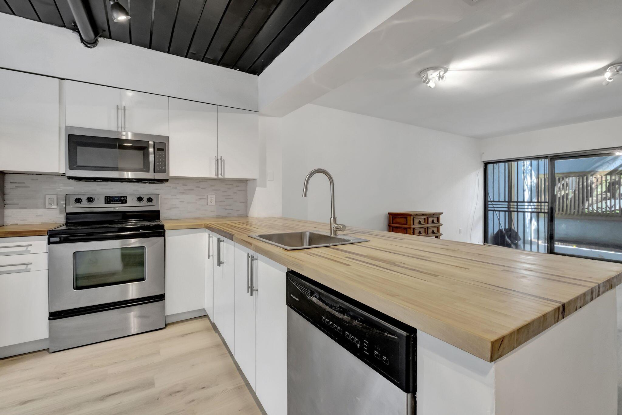 Gorgeous Renovated Town House located in PRIME LOCATION. Corona Bay is a Boutique 17 Unit Building. Walkthrough your front door to your open concept living area, with Spiral Staircase leading you to the bedrooms. Stainless Steel Appliances, W. Stunning Butcher Block Kitchen Counter tops. Washer/Dryer on patio. Unit Located in front of Community Pool / Jacuzzi Area. Steps to Magnolia Park & Intracoastal. Only a 5 minute walk to Mid Town and the Design District. Short drive to the beach. Upstairs features Two Bedrooms and Full Bath Upstairs with Connecting Doors & Double Vanity Sink. Main Living area features Half Bathroom Down Stairs. 3 Outdoor Patios, Master Bedroom, Front Entrance, & Living Room.