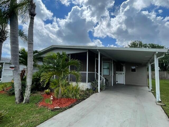 Manufactured home with redone kitchen, tiles, flooring, and newer A/C for you to enjoy! 2/2 home in 55+ community (other person can be 40+). Only 13 minutes from PBIA, 8 minutes to beaches, with new clubhouse, a pool, hot tubs, and security gate. In-unit laundry. RentSpree (or similar) report required. All residents must pass a background check done by the corporate park owners.
