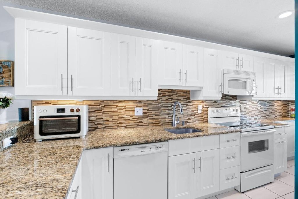 Photo of 1540 NW 18th Avenue #203, Delray Beach, FL 33445 (MLS # R11153919)