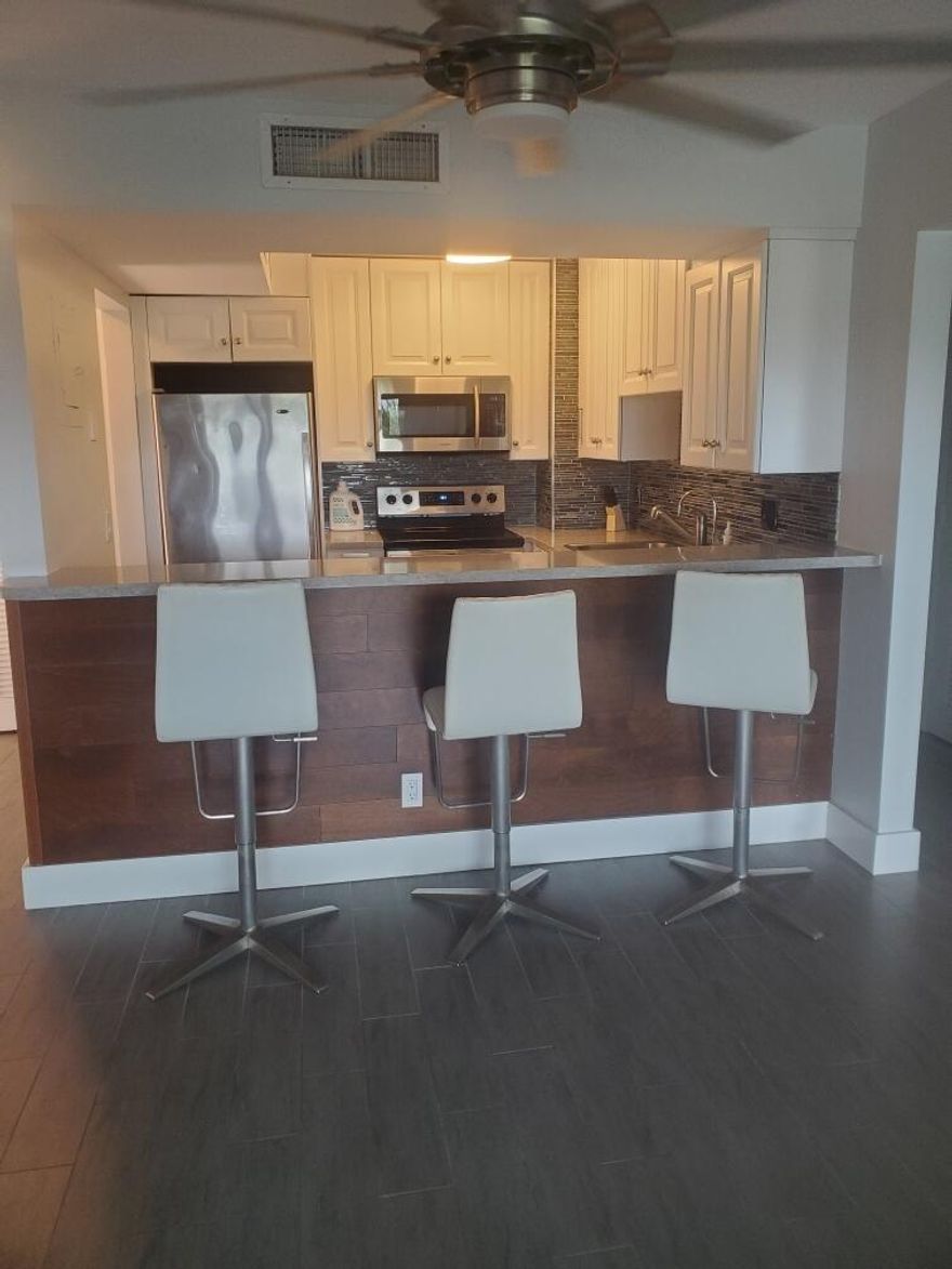 Welcome to this beautifully updated 1 bed/ 1.5 bath residence available for rent. This top floor unit with breathtaking water views has been fully & newly renovated with modern, clean design throughout.  Enjoy an open bright layout featuring updated finishes, sleek flooring & a contemporary kitchen & bathrooms that make everyday living both stylish & comfortable. Located in the highly desirable and secure gated tennis community, Lauderdale Tennis Club. This vibrant community provides full amenities, pool, tennis & pickle courts, fitness centre, clubhouse & onsite restaurant. Ideal location centrally located just minutes away from Los Olas, Wilton Manors, beaches, Downtown Ft Lauderdale, FLL airport, various restaurants, shopping centers & more. Fast & easy move in process