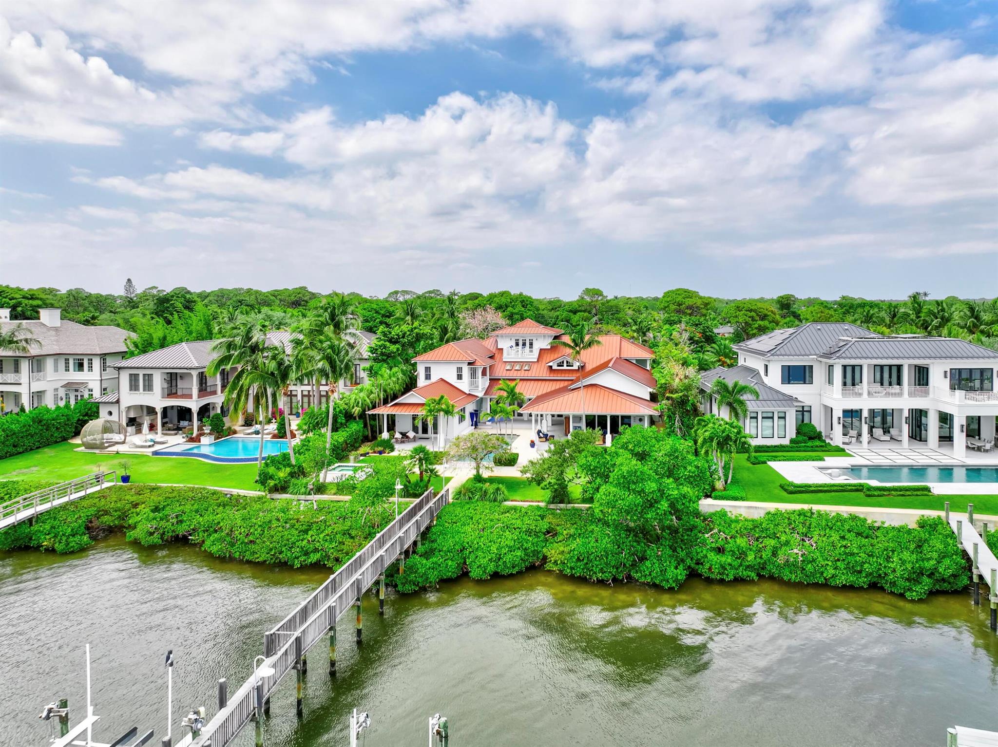 Exclusive waterfront living. Live like a pro in this luxurious waterfront home offered for lease. More photos coming soon. Welcome to your dream escape! This stunning furnished home on the Loxahatchee River in picturesque Jupiter, Florida, is the epitome of coastal elegance and charm. Designed with a light and bright ambiance, this residence offers an inviting blend of sophistication and relaxation, perfect for those seeking a serene retreat.Step inside to discover elegant, coastal-inspired interiors featuring open-concept living spaces with wide panoramic views of the sparkling river. Expansive windows flood the home with natural light, showcasing the breathtaking scenery and creating a seamless indoor-outdoor flow.