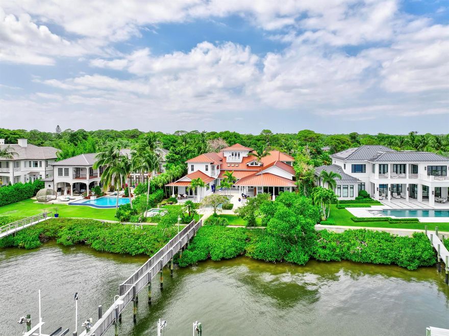Exclusive waterfront living. Live like a pro in this luxurious waterfront home offered for lease. Welcome to your dream escape! This stunning furnished home on the Loxahatchee River in picturesque Jupiter, Florida, is the epitome of coastal elegance and charm. Designed with a light and bright ambiance, this residence offers an inviting blend of sophistication and relaxation, perfect for those seeking a serene retreat.Step inside to discover elegant, coastal-inspired interiors featuring open-concept living spaces with wide panoramic 1 mile views of the sparkling river. Expansive windows flood the home with natural light, showcasing the breathtaking scenery and creating a seamless indoor-outdoor flow.