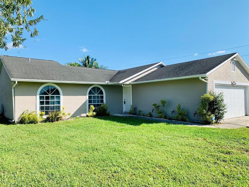 Photo of 515 SW Butler Avenue, Port Saint Lucie, FL 34983 (MLS # R10752853)