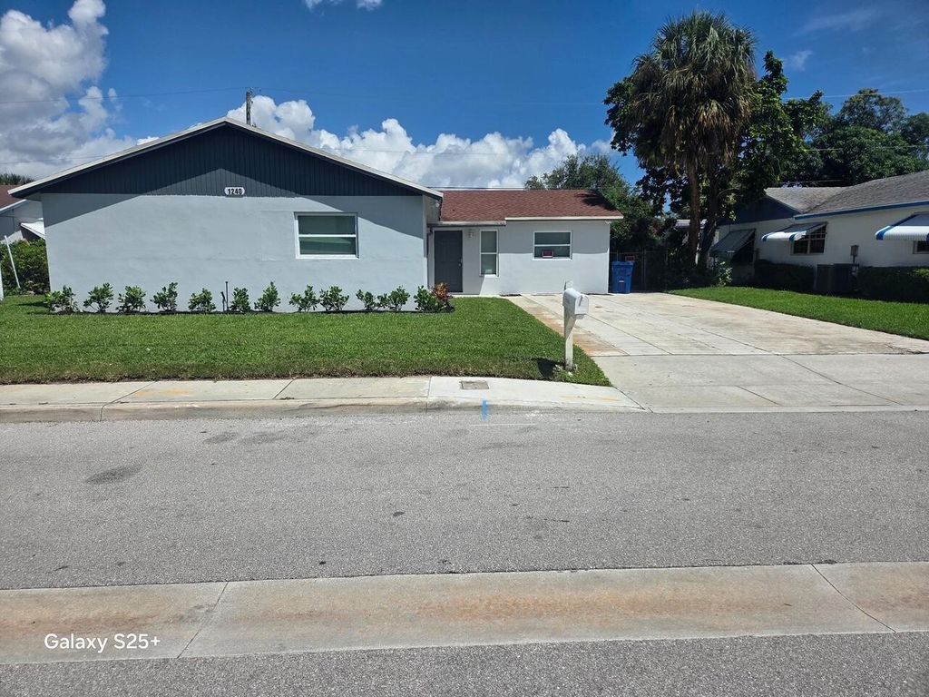 Photo of 1240 W 26th Street, Riviera Beach, FL 33404 (MLS # R11123771)