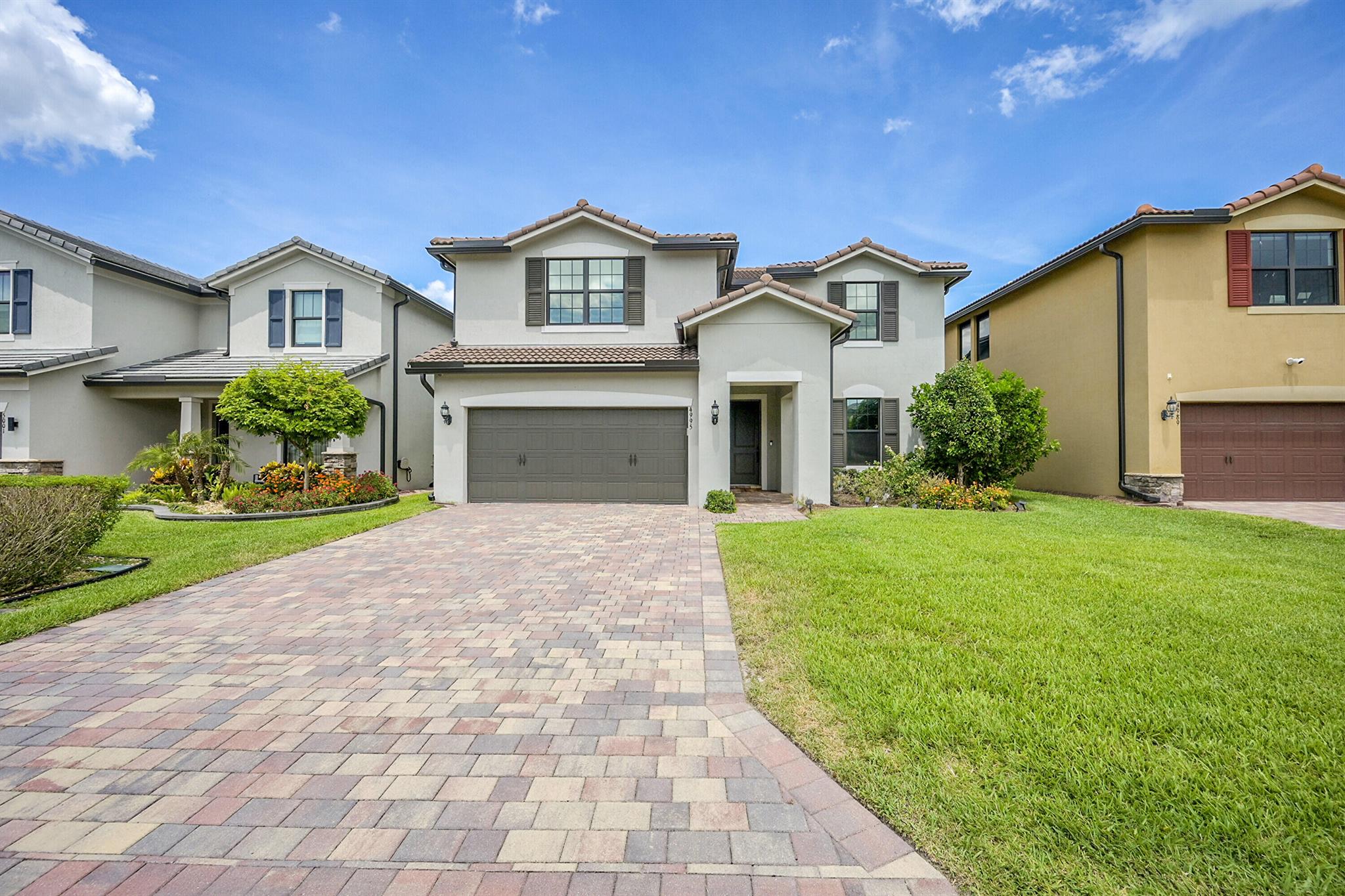Welcome to this beautifully designed 5-bedroom, 4-bathroom single-family home, nestled in a brand-new gated community within an A-rated school district. Step inside to a spacious open-concept floor plan featuring an expansive living area, perfect for entertaining or relaxing with family. Enjoy serene views from the covered patio. The main level includes a luxurious master suite, a guest bedroom with a full bathroom, and a convenient laundry room. Upstairs, you'll find three additional bedrooms, two full bathrooms, and a spacious loft--ideal for a media room, playroom, or home office. Don't miss your chance to live in a modern, move-in-ready home with premium features and unparalleled lake views.