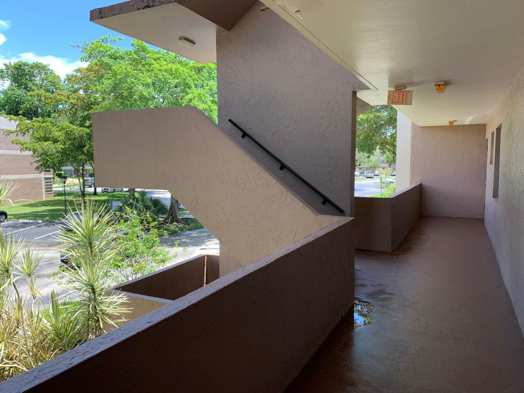 Photo of 8350 Sands Point Boulevard #E202, Tamarac, FL 33321 (MLS # B26004660)