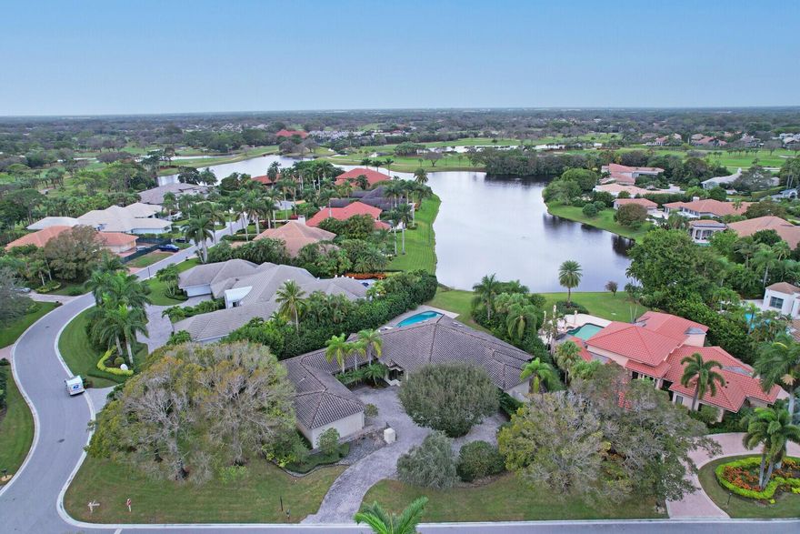 Single story custom Home featuring long water views and situated on anexpansive corner lot close to the Clubhouse and front entrance!