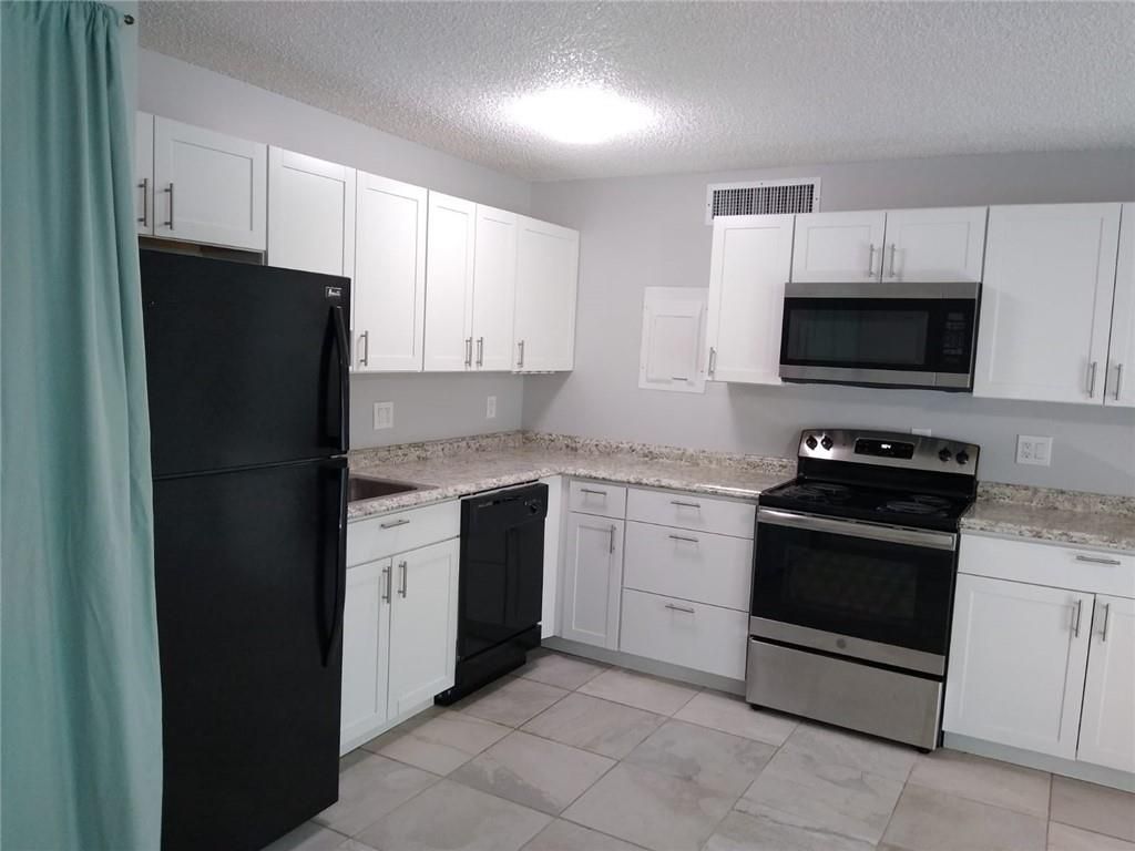 Photo of 645 Executive Center Dr #R205, West Palm Beach, FL 33401 (MLS # F10315679)