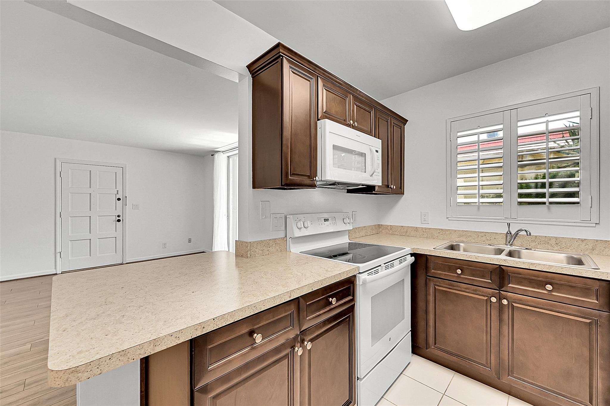 Beautiful 2 bedroom 2 bathroom condo in the heart of Boca in the 55+ community of Boca Linda. Beautifully updated condo with vinyl flooring throughout and updated bathroom. Closets are nicely redone with plenty of space. The condo is located on the first floor and features a washer/dryer all in one unit. The primary suite includes an ensuite bathroom and a generous walk-in closet, and plantation shutters on all windows. you're just minutes away from parks, shops, and delicious dining options. Whether you're enjoying a day at the beach or exploring the local scene, this community has it all. Don't miss your chance to call this lovely condo your home sweet home!