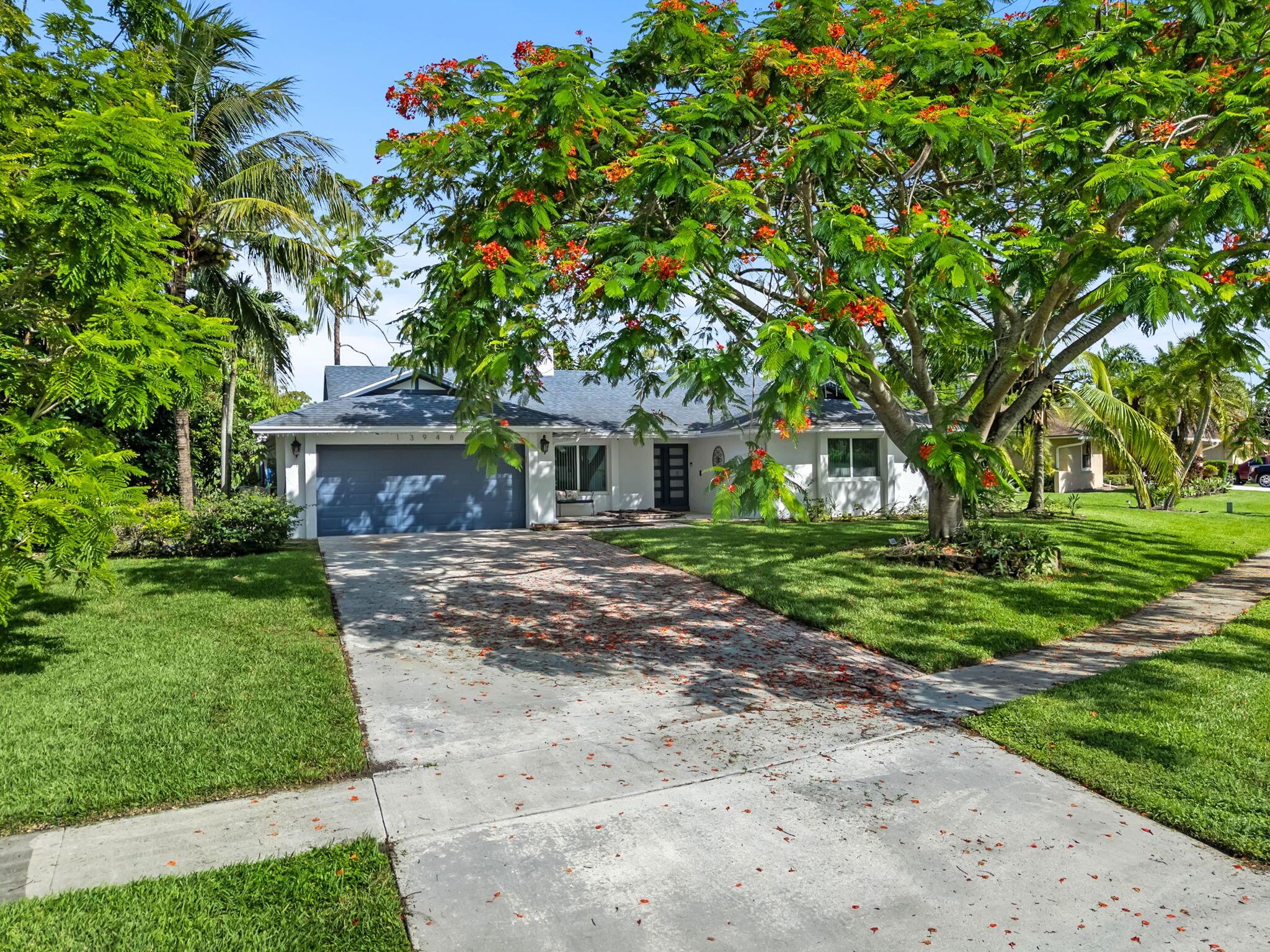 ** SHORT TERM RENTAL** Welcome to your private oasis in the heart of Wellington! This beautiful 3-bedroom, 2-bathroom pool home is nestled on a spacious lot in the sought-after community of Pinewood. Minutes from top-rated schools, equestrian venues, shopping, and dining.The home features an open-concept layout with vaulted ceilings, abundant natural light, and a seamless flow from the living area to the screened-in patio and sparkling poo. The updated kitchen offers granite countertops, stainless steel appliances, and a breakfast bar. The primary suite overlooks the pool and boasts a walk-in closet and en-suite bath with dual sinks and a soaking tub. Enjoy Florida living year-round in the expansive backyard with lush landscaping and a covered patio.