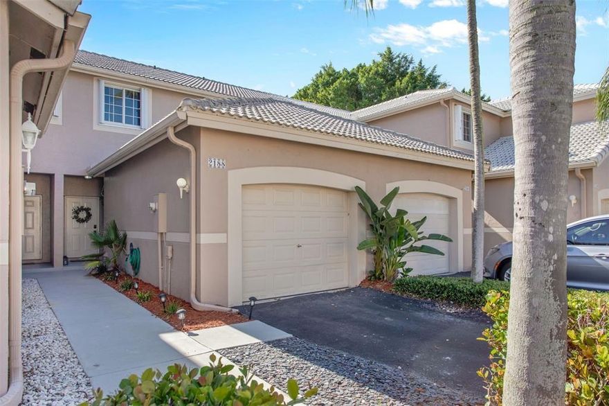 Enjoy this beautifully maintained 2 Bed, 2.5 Bath townhome in the conveniently located San Messina neighborhood in Weston. The open layout first floor includes a spacious light and bright kitchen with modern white cabinetry and appliances, a peninsula for counter seating, spacious dining and family room areas plus a half bath. Laundry in the 1 car garage, right off kitchen. Upstairs are 2 nice sized bedrooms, each with en-suite bathrooms, and ample closet space to provide comfortable living. Modern lighting and ceiling fans throughout. Sliding doors downstairs offer plentiful natural light and open to your dedicated outdoor patio space, surrounded by lush landscape. For more outdoor enjoyment, the community includes a playground and pool. The unit will be freshly painted before move in.