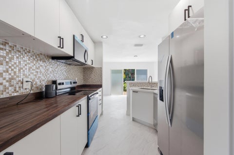 Photo of 2824 NW 99th Terrace, Sunrise, FL 33322 (MLS # B26044488)