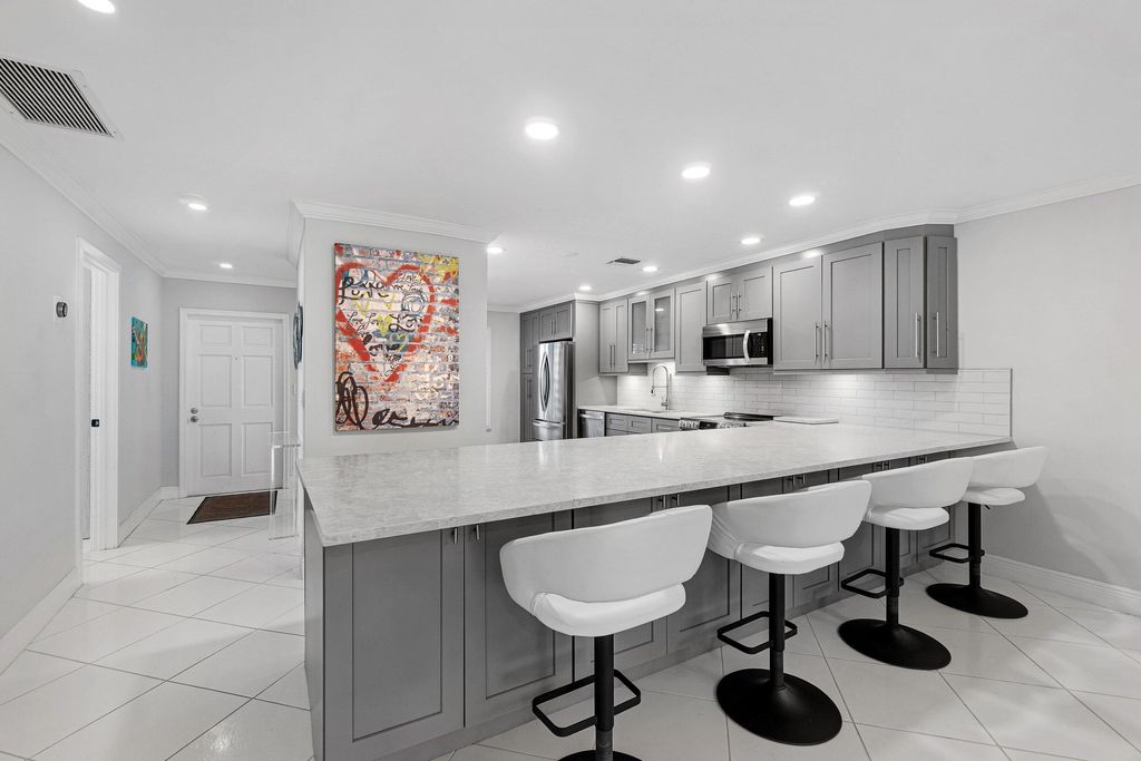 Photo of 1321 NW 19th Terrace #104, Delray Beach, FL 33445 (MLS # R11160662)