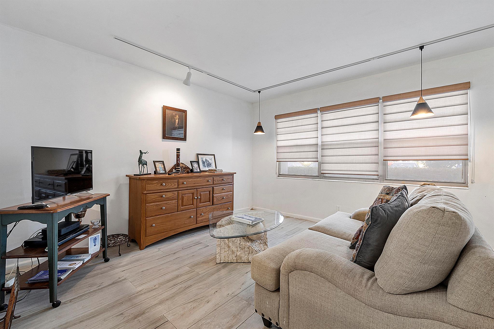 Remodeled Condo, ground floor. This condo over looks the water on your back patio. You will have access to your own private storage unit, community laundry room a few doors down (or add your own to the unit). Century village is abundant in amenities to use all at your leisure.