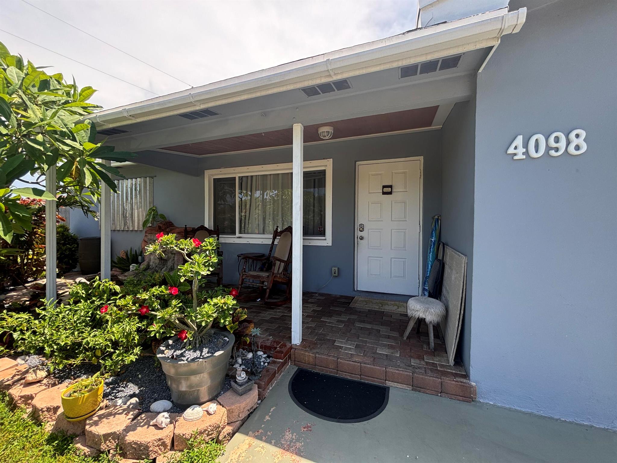 Come enjoy privacy and nature at this beautiful property in the heart of Palm Beach County. The property has 4 bedroom 2 baths. The main house is 3/1 and a mother in law apartment consisting of bedroom, living room, kitchen, and full kitchen. Currently generating a rental income of $1200.The backyard is ideal to bring pets, and enjoy a picnic with the family. Don't miss this opportunity for yourself or investment.