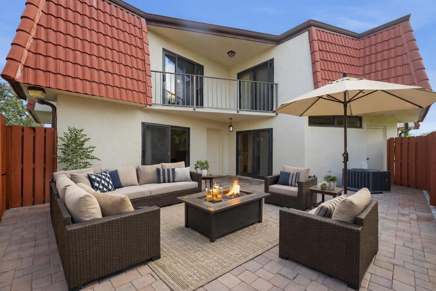 Spacious and light-filled 2-bedroom, 2.5-bathroom waterfront townhome featuring beautiful water views from both the primary and second bedrooms. Each bedroom offers a private full bath and balcony access. Enjoy no neighbors behind, a large yard overlooking the water, and a massive patio space perfect for entertaining. Home features newer A/C, water heater, and appliances, plus modern neutral finishes throughout. Ideally located near excellent schools, shopping, and dining, and just 15 minutes to the beach. Community allows immediate rentals and the HOA covers lawn maintenance, trash, and pool amenities. Perfect for first-time buyers or investors--don't miss this opportunity!