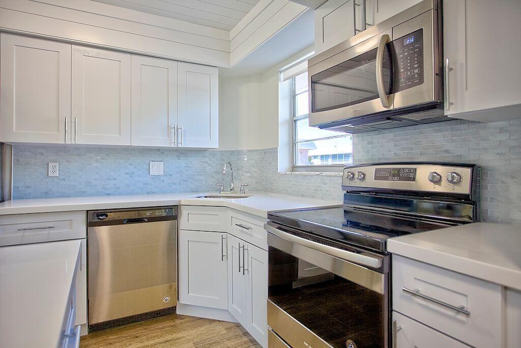 Free unlimited golf!!! Beautiful views of the par 3 course. Completely updated unit with quartz counters, stainless appliances and solid wood cabinets with soft close doors. This is a 55 plus age community. At least one person must be 55 years old to be approved through the association. Community amenities include par 3 golf, clubhouse, pool, tennis, pickleball and shuffleboard. No animals permitted. Roll down shutters for the patio and panels for all windows. Water and cable included.
