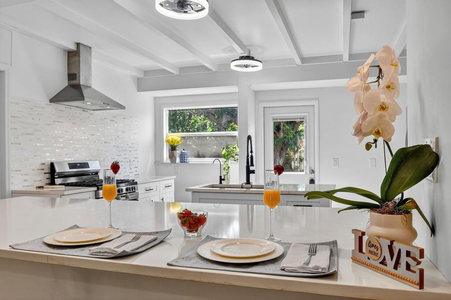 Beautifully Remodeled 2 Bedroom/2 Bath Single Family with 1 Car Garage, Plus a Studio Apartment with a Newly Remodeled Kitchen, Bath Perfect for a Lucrative AirBnB/Sort-Term Rental, Family or Long Term Rental of $1,400 Plus a Month. The Moment you Enter, You are Greeted By an Open, Sunlit Floorplan that Feels Spacious and Inviting.Designer Kitchen is a Chef's Dream, Showcasing Quartz Countertops, Shaker Cabinets,Stainless Steel Appliances Plus a Natural Gas Oven Perfect for Entertaining or Family Gatherings.Every Detail has Been Updated, Roof, A/C,Impact Windows, Electrical Panels, Lighting Fixtures, and Stunning Spa-Inspired Bathrooms with Luxury Finishes.Rich Plank Flooring Tying Together Modern Coastal Elegance. Fenced Backyard, Large Enough to Add a Pool, Park a Boat or RV.