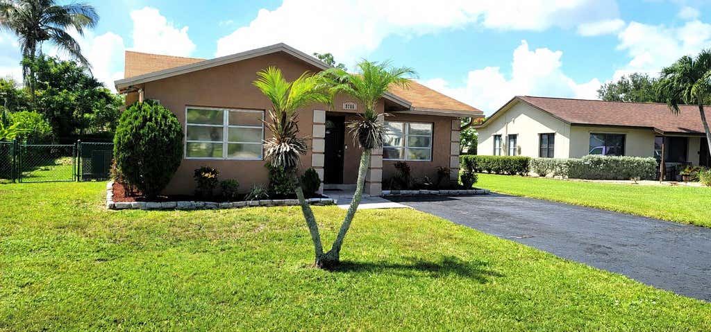 Photo of 9706 NW 71ST Street, Tamarac, FL 33321 (MLS # B26058774)