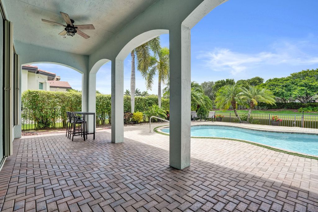 Photo of 12370 NW 80th Place, Parkland, FL 33076 (MLS # B26049622)
