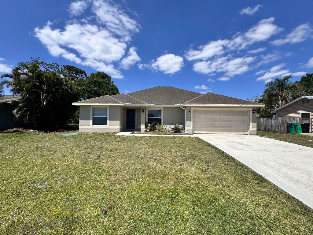 Photo of 1625 SW Bellevue Avenue, Port Saint Lucie, FL 34953 (MLS # R11082615)