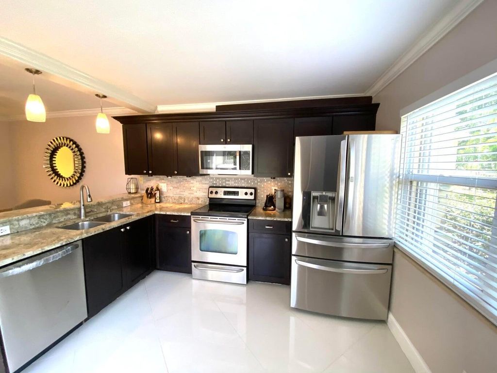 Photo of 40 Essex Court #A, Royal Palm Beach, FL 33411 (MLS # R11169760)