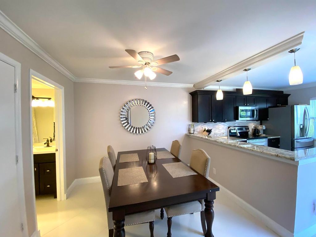 Photo of 40 Essex Court #A, Royal Palm Beach, FL 33411 (MLS # R11169760)