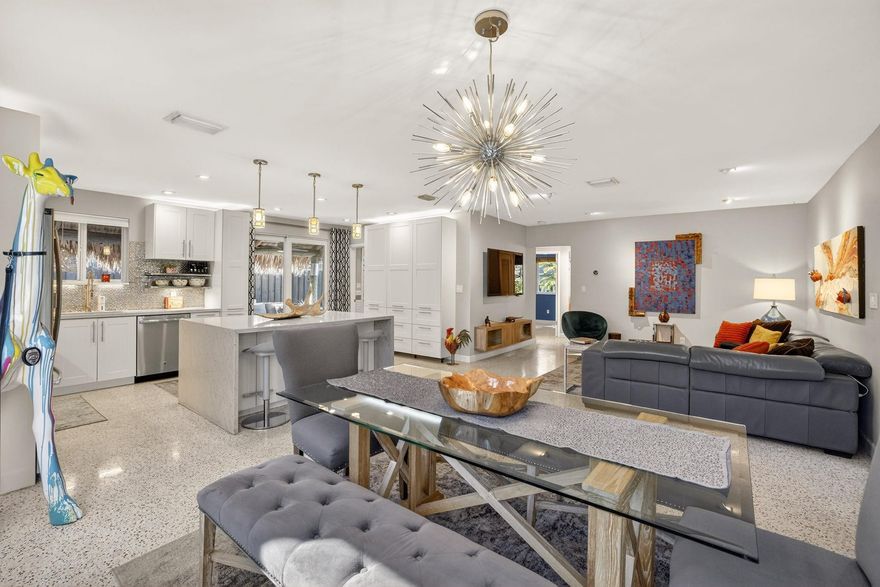 CORAL HEIGHTS modern 3/3 MID-CENTURY POOL HOME on CUL-DE-SAC CORNER LOT, with an INCREDIBLE OUTDOOR ENTERTAINMENT OASIS for true indoor-outdoor living. OPEN-CONCEPT layout with polished terrazzo flrs, designer lighting, and custom SMART STORAGE BUILT-INS. SHOWPIECE KITCHEN opens to living/dining and features oversized island, abundant cabinetry, granite, glass tile backsplash and premium SS appls. LUX HOTEL-STYLE PRIMARY SUITE overlooks a tranquil pond with DIRECT POOL ACCESS, plus spa-like ENSUITE with STEAM SHOWER. Private resort backyard: SALTWATER HEATED POOL (2018), tropical gardens, and MASSIVE 30’ TIKI HUT for outdoor living & entertaining. Govee perimeter/landscape lighting sets the night vibe. NEW W/D. FULLY REMODELED. IMPACT WDS/DRS. TANKLESS H2O. NEW SEWER LINES. 2 WATER METERS. CORAL HEIGHTS modern, 3 bedroom, 3 bath MID-CENTURY POOL HOME on cul-de-sac  corner lot, with an INCREDIBLE ALL-WEATHER OUTDOOR ENTERTAINMENT OASIS for true indoor-outdoor living. OPEN-CONCEPT LAYOUT with polished terrazzo floors throughout, designer lighting, and custom built-ins that add smart storage and clean style. The SHOWPIECE KITCHEN flows into the living and dining areas and features an oversized island, extensive cabinetry, granite counters, glass tile backsplash, and premium stainless appliances.The SPACIOUS HOTEL-STYLE PRIMARY SUITE with direct patio access, overlooks a tranquil koi pond and tropical pool. All three bathrooms are fully updated with premium, spa-inspired finishes, including an ENSUITE WITH STEAM SHOWER. Step outside to your private resort: SALTWATER HEATED POOL (2018) with NEW pool heater, peaceful tropical gardens, and a MASSIVE 30’ TIKI HUT for outdoor living and entertaining. NEW Govee perimeter and landscape lighting sets the vibe at night, plus a Nest system for smart-home convenience. NEW washer & dryer.FULLY REMODELED. IMPACT WINDOWS & DOORS. Tankless water heater. NEW SEWER LINES. Newer ductwork. 2 water meters. See Matterport tour available.