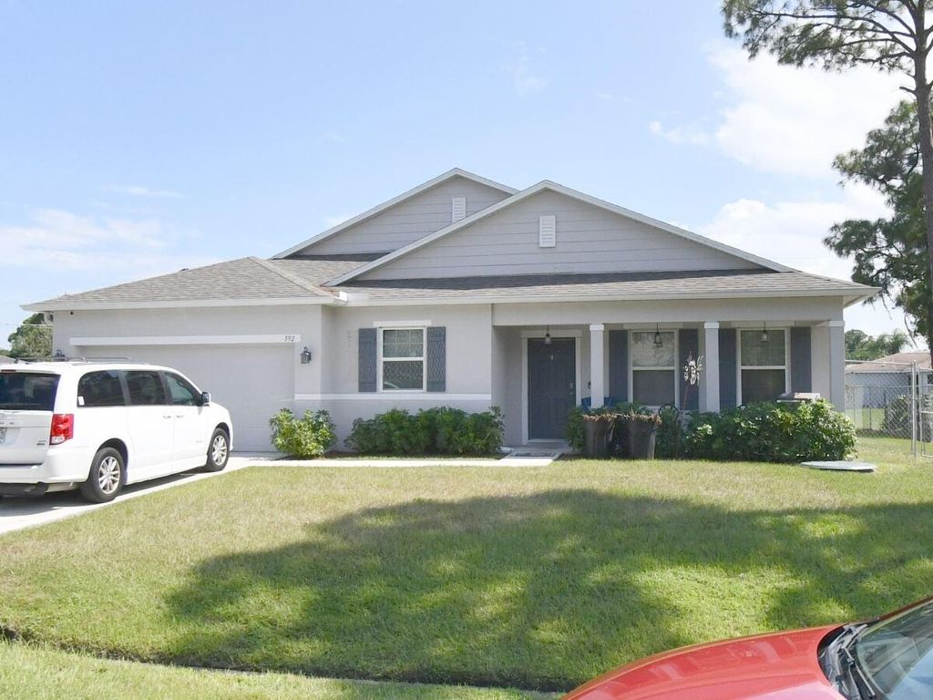 Photo of 592 SE Wallace Ter, Port Saint Lucie, FL 34953 (MLS # R11048302)