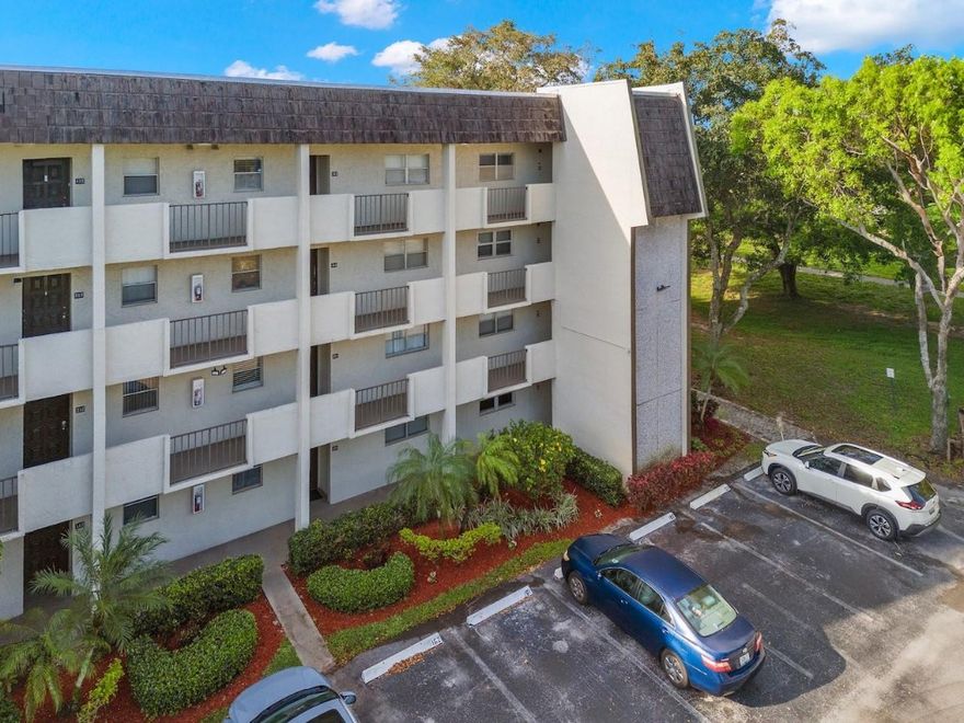 Best location in the Greens of Inverrary Community, very desirable 1st floor corner unit, walk down short path behind the unit to the Clubhouse, Swimming Pool/cabana Area. Nicely renovated 2Bed 2Bath incl: wood cabinets, granite countertops, tile throughout with laminate in the kitchen. Features include outdoor screened patio with 2 entries, one from living room and primary bedroom. Primary bath has double sinks, complete shower system with nozzles/jets, glass doors, 2 walk in closets, and storage. Impact Windows/doors, except sliders that have hurricane protection. Also has stacked full size washer/dryer in unit. This 55+ community amenities include a clubhouse, swimming pool, cabana area, gym, 1 parking spot. The association dues include water, cable internet & common area landscaping.