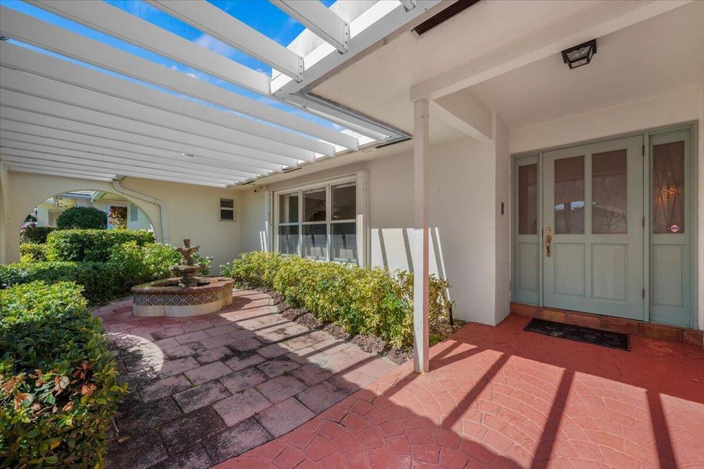 Photo of 103 Olympus Cir, Jupiter, FL 33477 (MLS # B26000744)