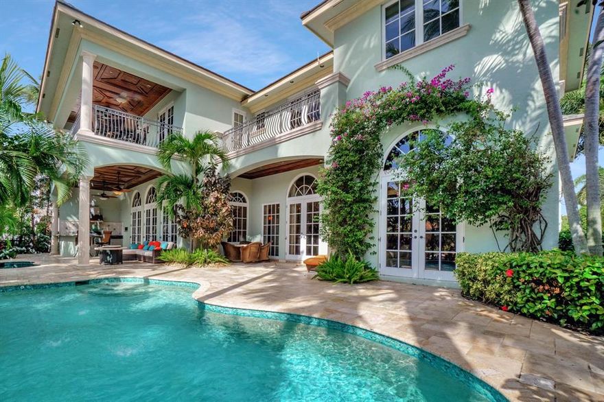 Stunning British Colonial waterfront residence originally a builder's own home completed in 2003.  Extraordinary attention to detail and superlative finishes. This deepwater estate has SE exposure and is located in desirable Golden Harbour. Minutes from the inlet, it is a boater's dream. No expense was spared in this waterfront residence featuring massive double entry mahogany doors, mosaic inlaid marble & hardwood flooring, coffered ceilings, custom painted precision millwork & crown moldings throughout, hand painted mural on breathtaking 2 story Grand Foyer ceiling. Wrap around staircase with elegant detail. The living room has oak hard wood floors, fireplace, French doors & brilliant water views. The gourmet chef's kitchen is equipped w/ SubZero double refrigerator & Wolf  range