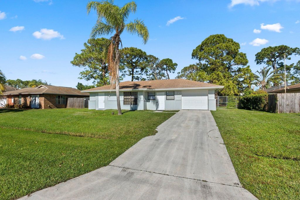 Photo of 1251 SW Sudder Avenue, Port Saint Lucie, FL 34953 (MLS # R10982716)