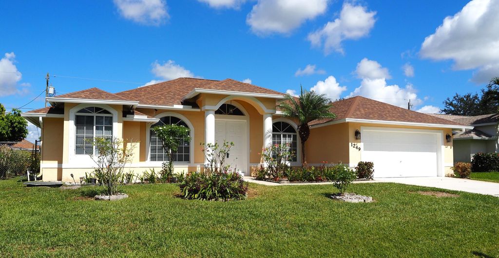 Photo of 1249 SW Hunnicut Avenue, Port Saint Lucie, FL 34953 (MLS # R10917276)