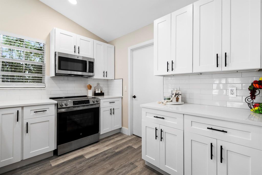 Photo of 1557 Royal Forest Court, West Palm Beach, FL 33406 (MLS # R11108421)