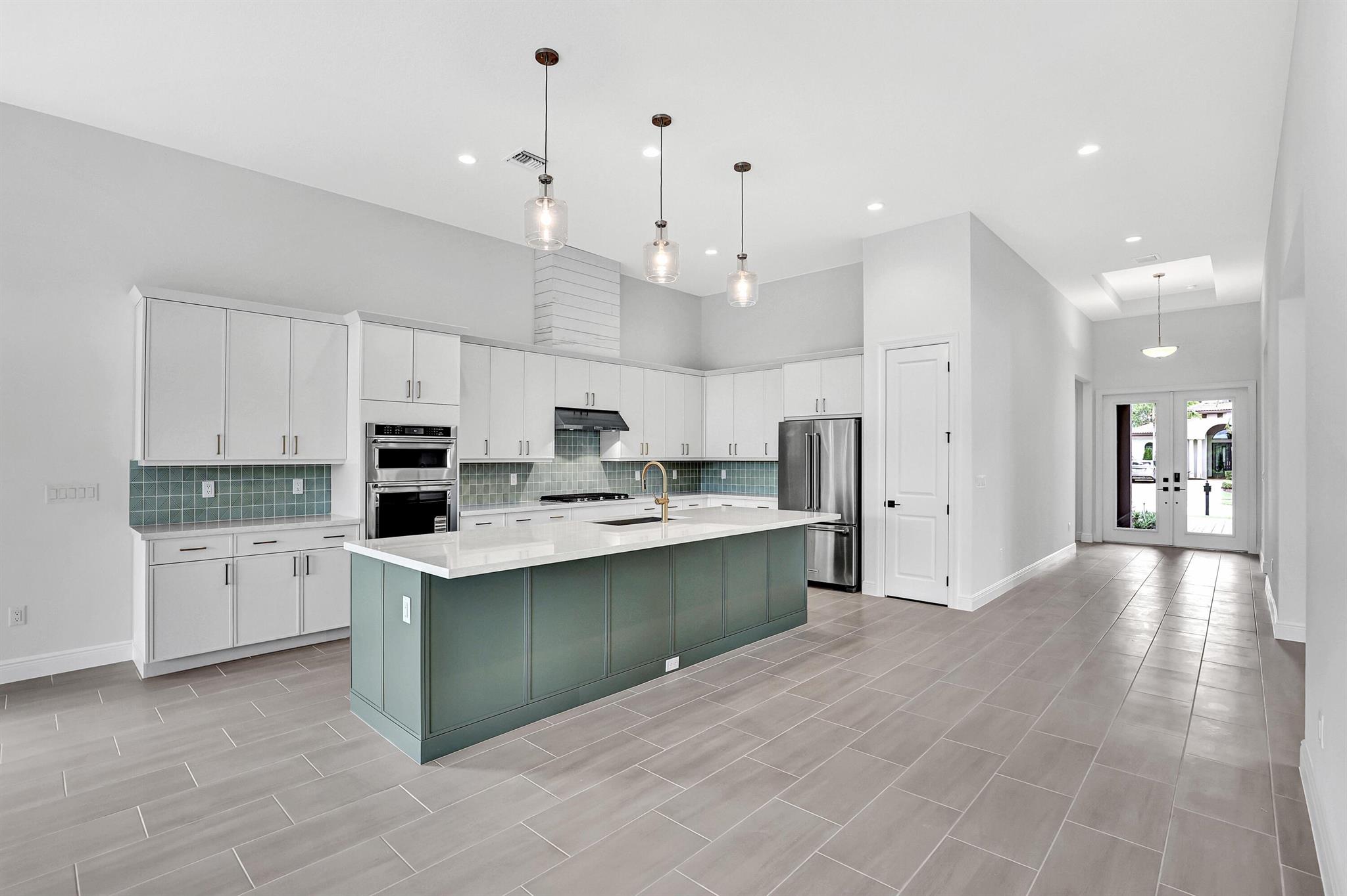 Located in the exclusive, gated Tesoro Club--a premier private country club community--this move-in ready 3-bedroom, 2.5-bath home offers a perfect blend of luxury, comfort, and style. The open-concept layout features elegant tray ceilings, sleek porcelain flooring, and impact-rated windows and doors that bring in abundant natural light. The gourmet kitchen is a chef's dream, with a 5-burner gas cooktop, stainless steel appliances, and quartz countertops. The spacious primary suite overlooks a serene backyard retreat, offering peace and privacy. Ideal for entertaining or relaxing, the backyard is perfect for outdoor living, and an 8' extended garage provides room for a golf cart. Experience elevated living at Tesoro Club!