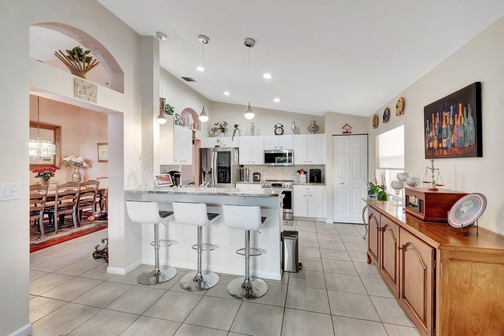 Photo of 5670 Swaying Palm Lane, Boynton Beach, FL 33437 (MLS # R11151250)