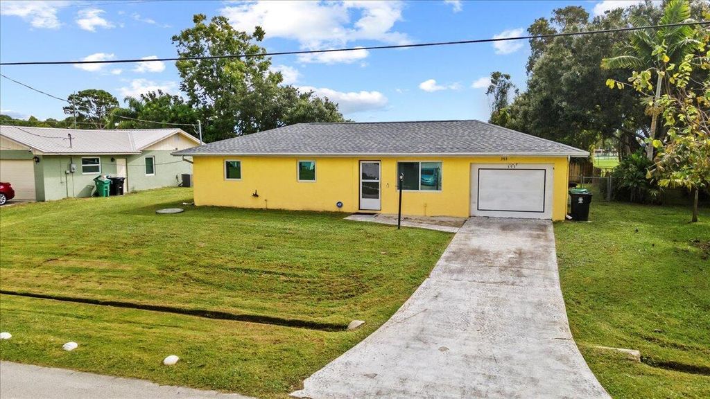 Photo of 393 NW Curtis Street, Port Saint Lucie, FL 34983 (MLS # R11126435)