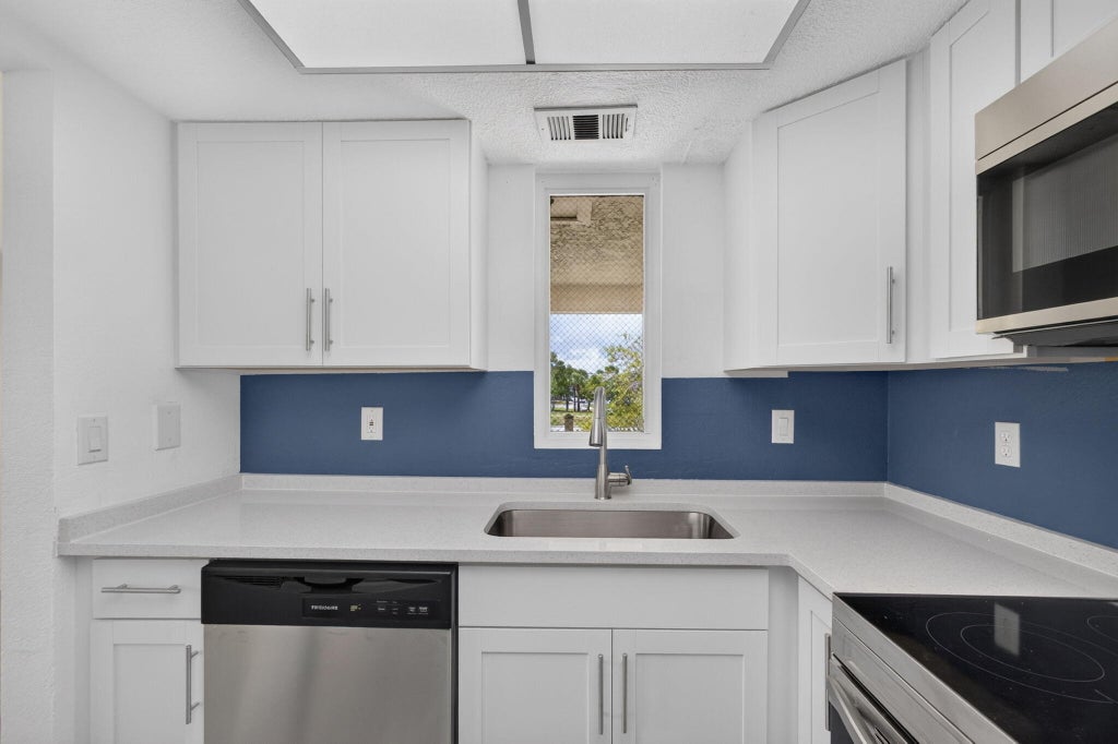 Photo of 1536 SE Royal Green Circle #201, Port Saint Lucie, FL 34952 (MLS # B26072887)