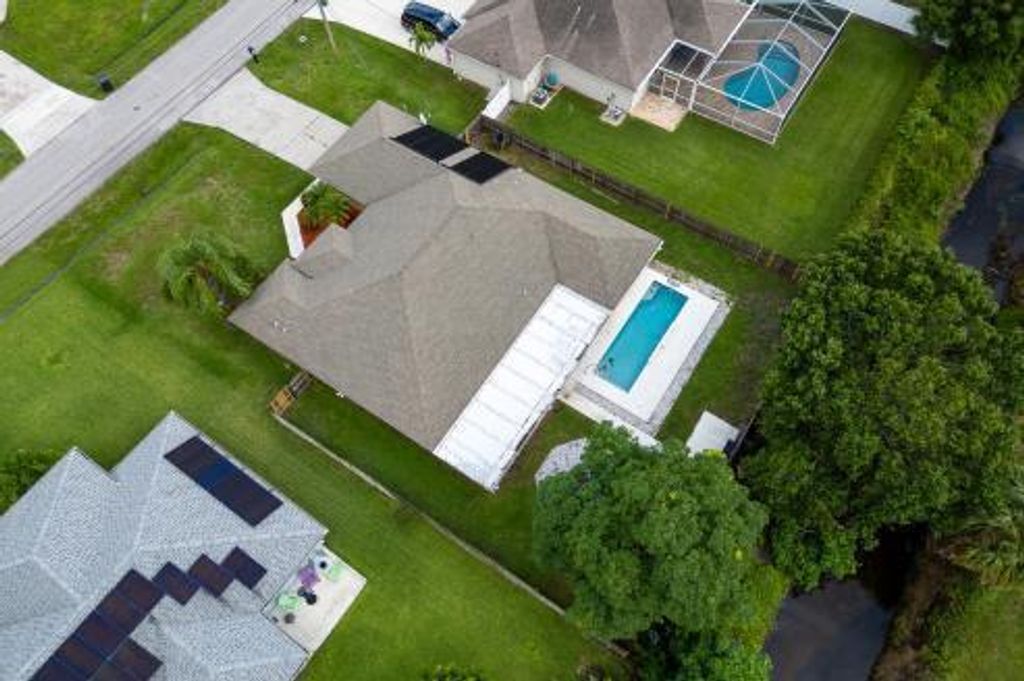 Photo of 3718 SW Masilunas Street, Port Saint Lucie, FL 34953 (MLS # R11100231)