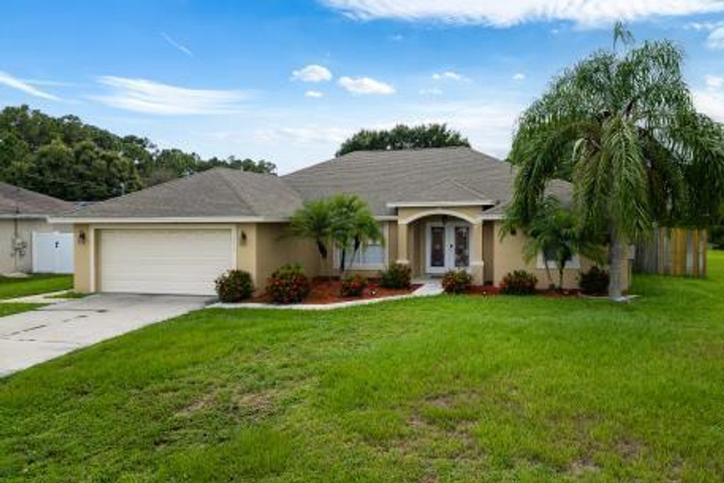 Photo of 3718 SW Masilunas Street, Port Saint Lucie, FL 34953 (MLS # R11100231)