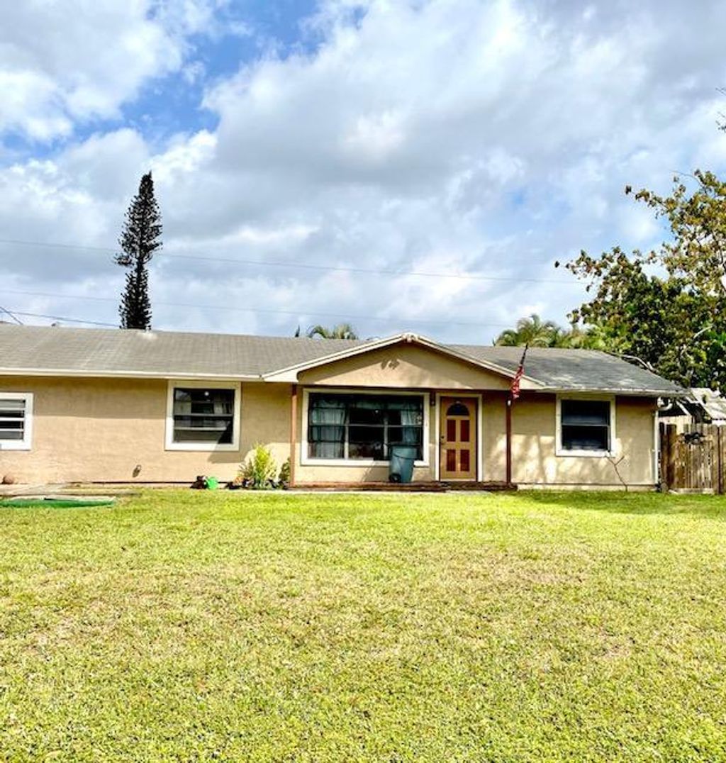 Photo of 9219 Artist Place Pl, Lake Worth Beach, FL 33467 (MLS # R10695109)