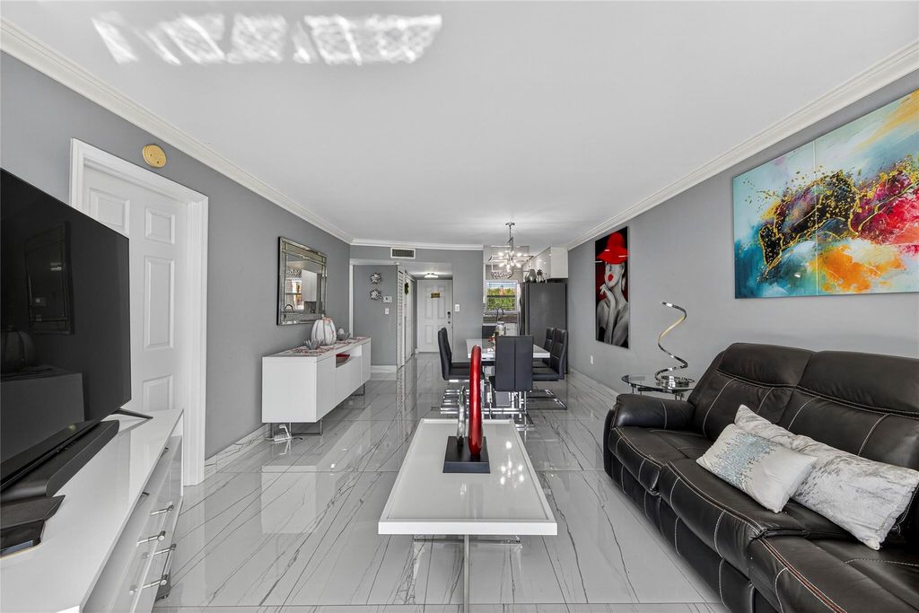 Photo of 2741 N Pine Island Rd #302, Sunrise, FL 33322 (MLS # F10533350)